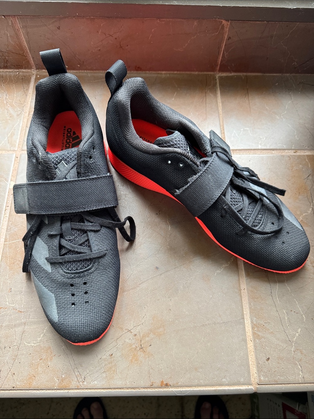 adidas Black Athletic weightlifting Shoes with Orange Sole Accent